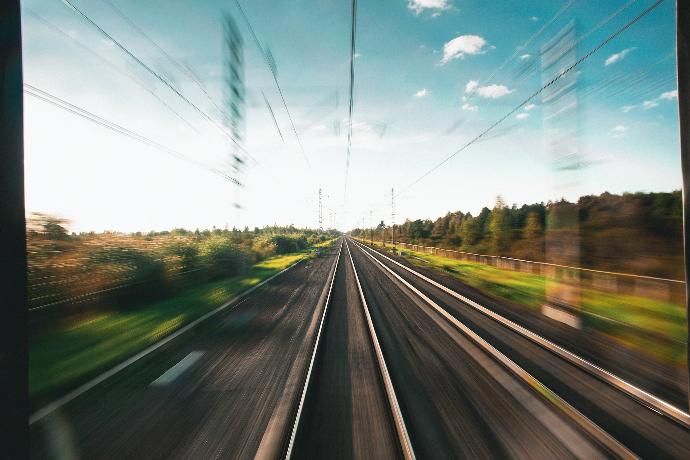 a view of a train track from a moving train